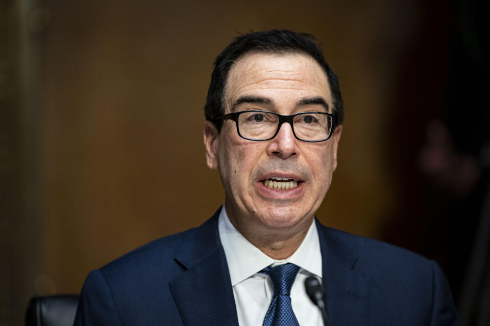 Treasury Secretary Steven Mnuchin speaks during a Senate Banking Committee hearing on Capitol Hill, on Tuesday, Dec. 1, 2020, in Washington. (Al Drago/The New York Times via AP, Pool)