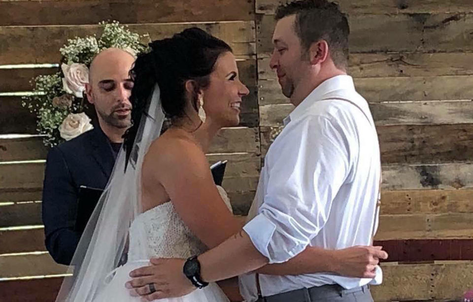 Jeremy Bourasa and his bride Krista, of Minnesota, were tying the knot earlier this month at the St Paul Park fire station where he works when he had to leave to fight a housefire. Source: Facebook/ Krista Bourasa