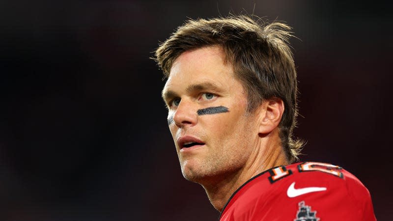 Tom Brady looking to the side with a blank stare