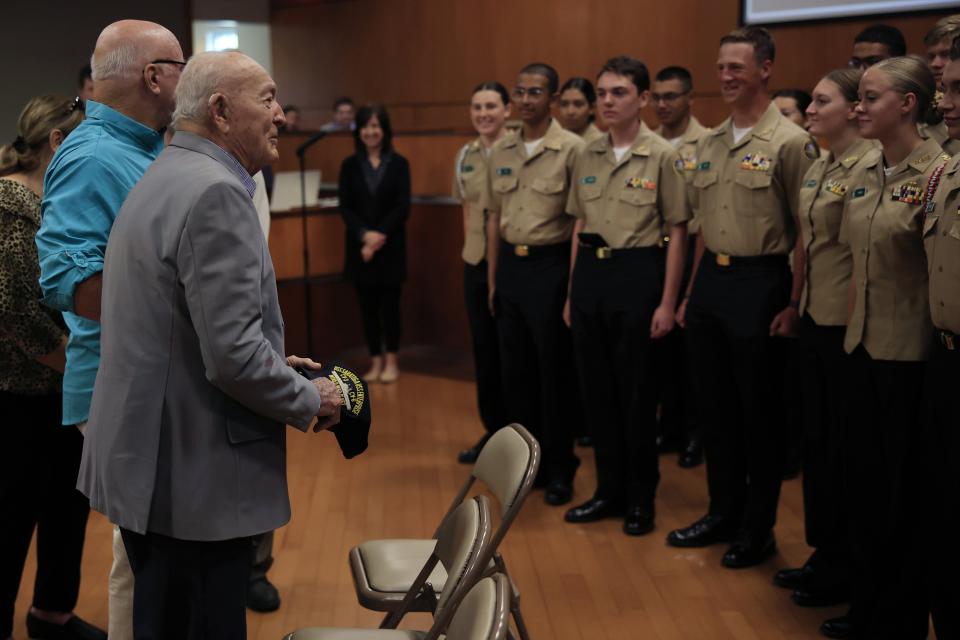 John L. Patton, a 100-year-old Navy veteran, speaks to Navy JROTC Cadets from Nease High School at a ceremony in his honor in St. Augustine.