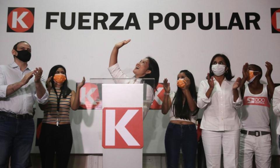 Keiko Fujimori waves during a speech at party headquarters in Lima, Peru, on 11 April.