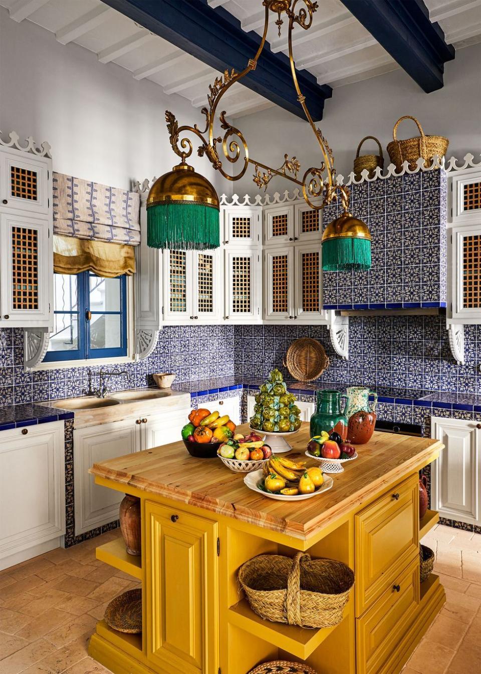 a kitchen with a table and a basket with fruit on it