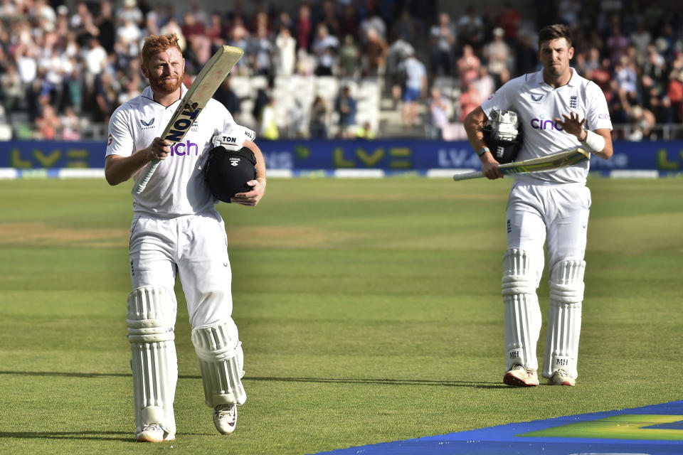 England's Jonny Bairstow, left, and Jamie Overton leave the field at the end of play on the second day of the third cricket test match between England and New Zealand at Headingley in Leeds, England, Friday, June 24, 2022. (AP Photo/Rui Vieira)