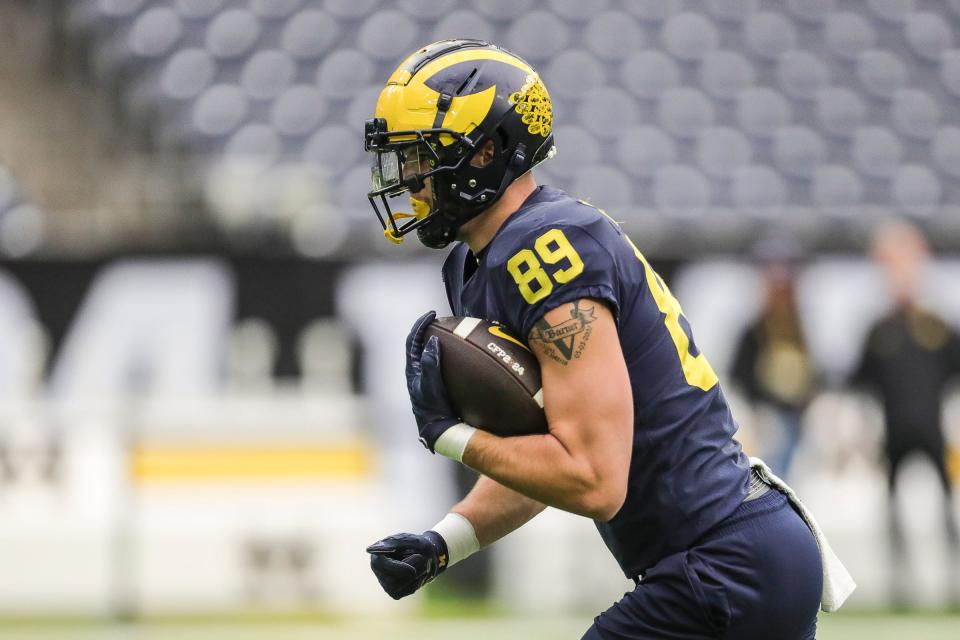 Michigan tight end AJ Barner (89) runs a drill during open practice at NRG Stadium in Houston, Texas on Saturday, Jan. 6, 2024.