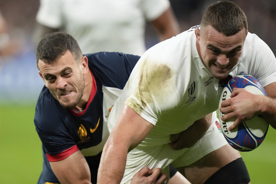 England's Ben Earl scores a try during the Rugby World Cup third place match between England and Argentina at the Stade de France in Saint-Denis, outside Paris, Friday, Oct. 27, 2023. (AP Photo/Pavel Golovkin)