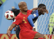 <p>Belgium’s Vincent Kompany, left, and France’s Paul Pogba vie for the ball during the semifinal match between France and Belgium at the 2018 soccer World Cup in the St. Petersburg Stadium, in St. Petersburg, Russia, Tuesday, July 10, 2018. (AP Photo/Petr David Josek) </p>