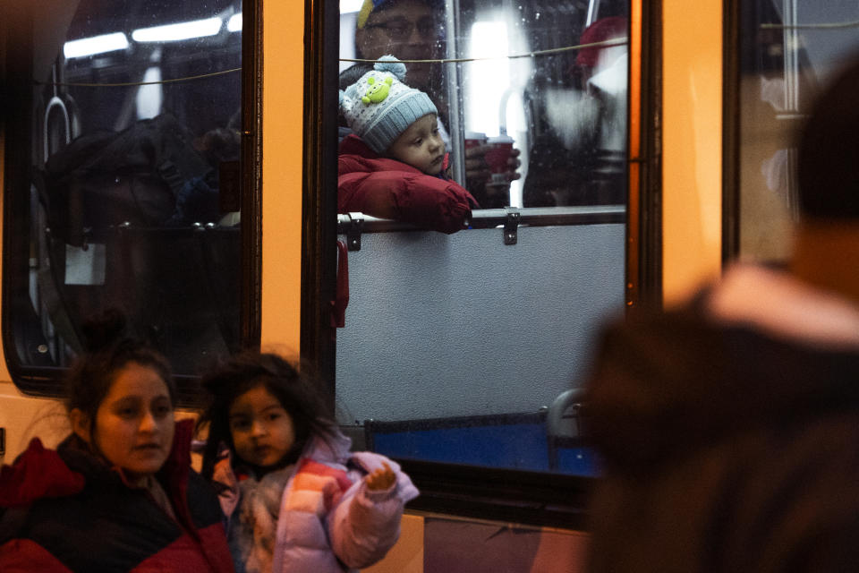 Migrants sent by Texas Gov. Greg Abbott arrive near 30th Street Station Wednesday morning, Nov. 16, 2022, in Philadelphia. Abbott has sent the buses to Democratic-led cities as a way to maximize exposure over what he says is inaction by the Biden administration over high numbers of migrants crossing on the southern border. (AP Photo/Joe Lamberti)