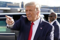 President Donald Trump gestures to supporters as he arrives at Minneapolis Saint Paul International Airport, Wednesday, Sept. 30, 2020, in Minneapolis. (AP Photo/Alex Brandon)