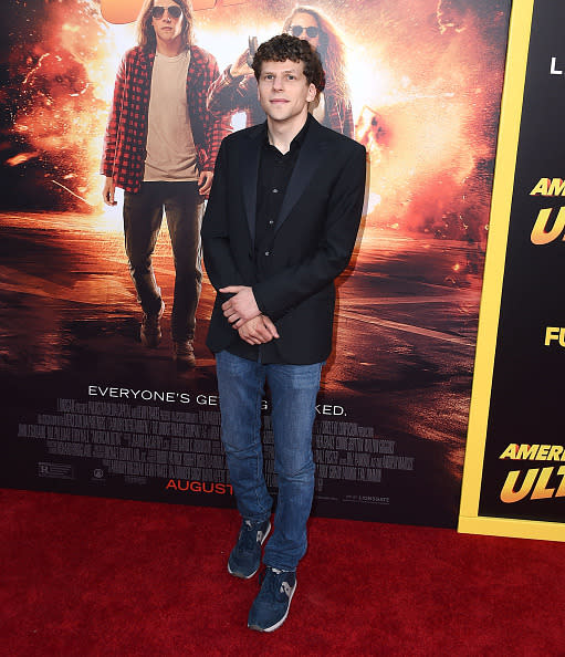 Jesse Eisenberg in jeans and a blazer.