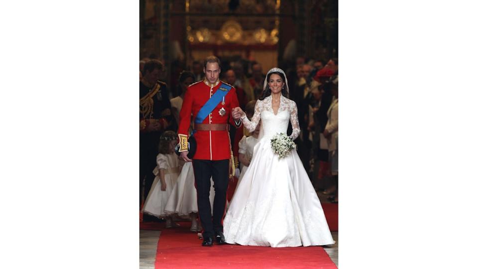 Prince William and Princess Kate walking hand and hand out of Westminster Abbey