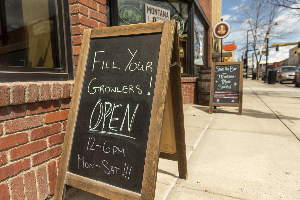 BOZEMAN, MT - MAY 04: Signs for restaurants and stores announce their reopenings on Main Street on May 4, 2020 in Bozeman, Montana. Wyoming health officials today reported that the state's confirmed coronavirus cases grew by nine to a total of 444. (Photo by William Campbell/Getty Images)