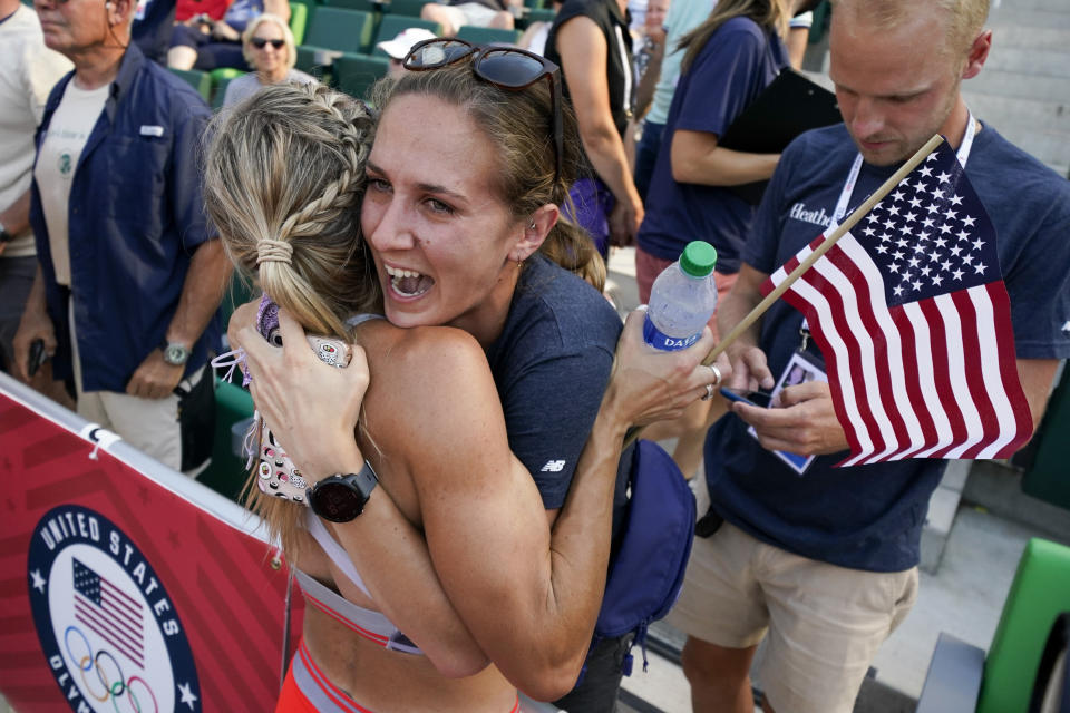 Elle Purrier St. Pierre, left, hugs Lianne Farber after winning the women's 1500-meter run at the U.S. Olympic Track and Field Trials Monday, June 21, 2021, in Eugene, Ore. (AP Photo/Ashley Landis)