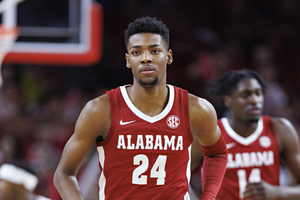 FAYTVILLE, AR - JANUARY 11: Brandon Miller #24 of the Alabama Crimson Tide runs off the field during a game against the Arkansas Razorbacks at Bud Walton Arena on January 11, 2023 in Fayetteville, Arkansas.  The Crimson Tide defeated the Razorbacks, 84-69.  (Photo by Wesley Heat/Getty Images)