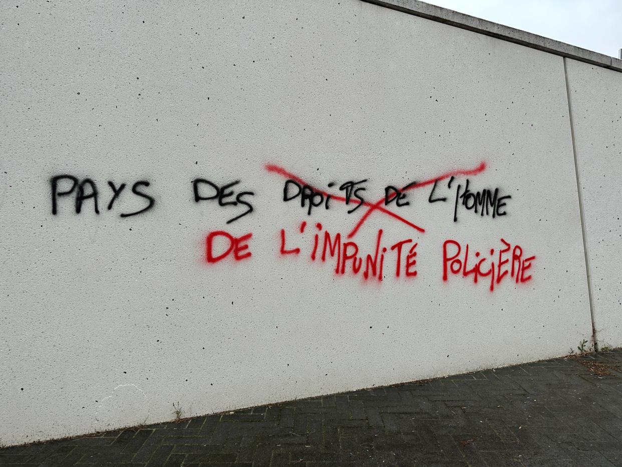 “Country of human rights” has been crossed out and replaced with “country of police immunity” on one wall in Nanterre (Bel Trew / The Independent)