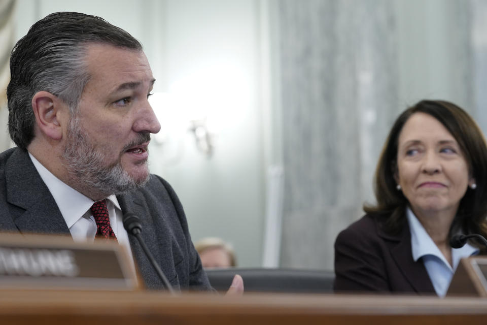 Sen. Ted Cruz, R-Texas, left, and Sen. Maria Cantwell, D-Wash., right, speak during a Senate Commerce Committee hearing, Thursday, Feb. 9, 2023, on Capitol Hill in Washington, about the December meltdown at Southwest Airlines that led to nearly 17,000 canceled flights over the holidays. (AP Photo/Mariam Zuhaib)