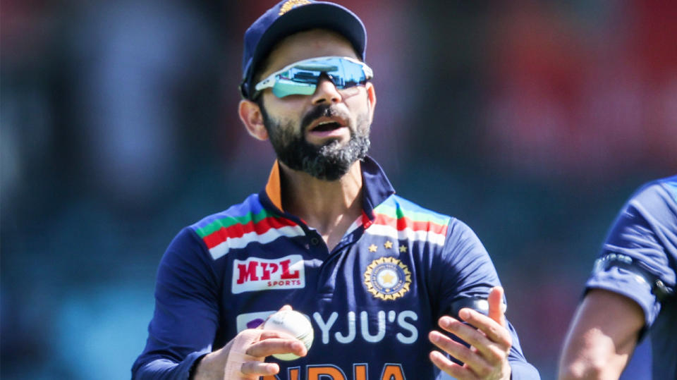 Virat Kohli (pictured) talking to his bowler during the one-day international.