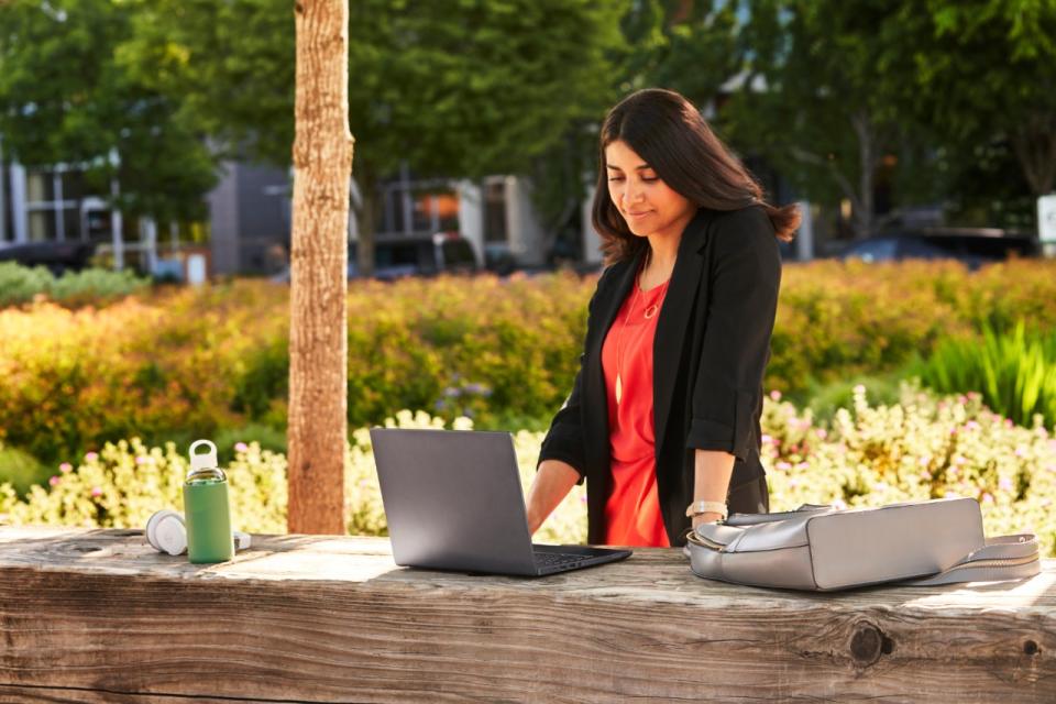 A woman using an Intel Evo branded notebook.