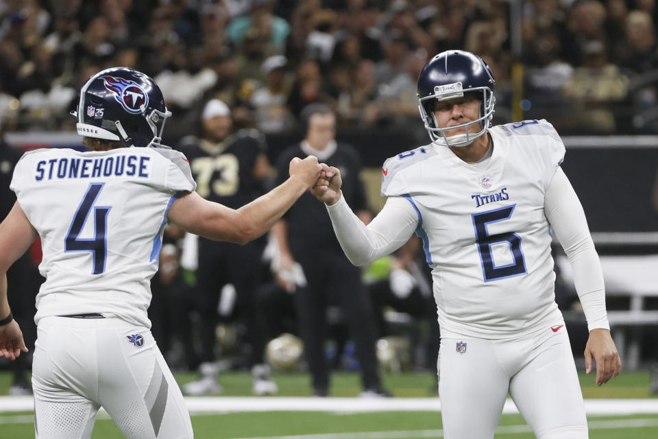 Tennessee Titans punter Ryan Stonehouse (4) congratulates place-kicker Nick Folk (6) after his 50-yard field goal against the New Orleans Saints in the first half of an NFL football game in New Orleans, Sunday, Sept. 10, 2023. (AP Photo/Butch Dill)