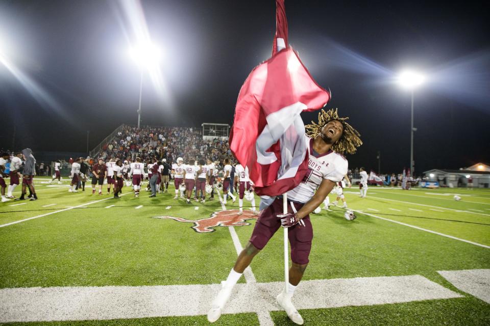 Madison County Cowboys celebrate their victory. Madison County defeated Hawthorne 13-12 to claim the Class 1A State Championship title at Gene Cox Stadium on Saturday, Dec. 11, 2021.