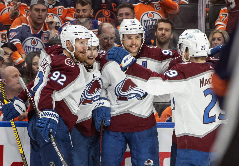 CORRECTS ID TO MIKKO RANTANEN, NOT KURTIS MACDERMID AS ORIGINALLY SENT - Colorado Avalanche's Gabriel Landeskog (92), Artturi Lehkonen (62), Mikko Rantanen (96) and Nathan MacKinnon (29) celebrate a goal against the Edmonton Oilers during third period NHL hockey conference finals action in Edmonton, Alberta, on Monday, June 6, 2022. (Jason Franson/The Canadian Press via AP)