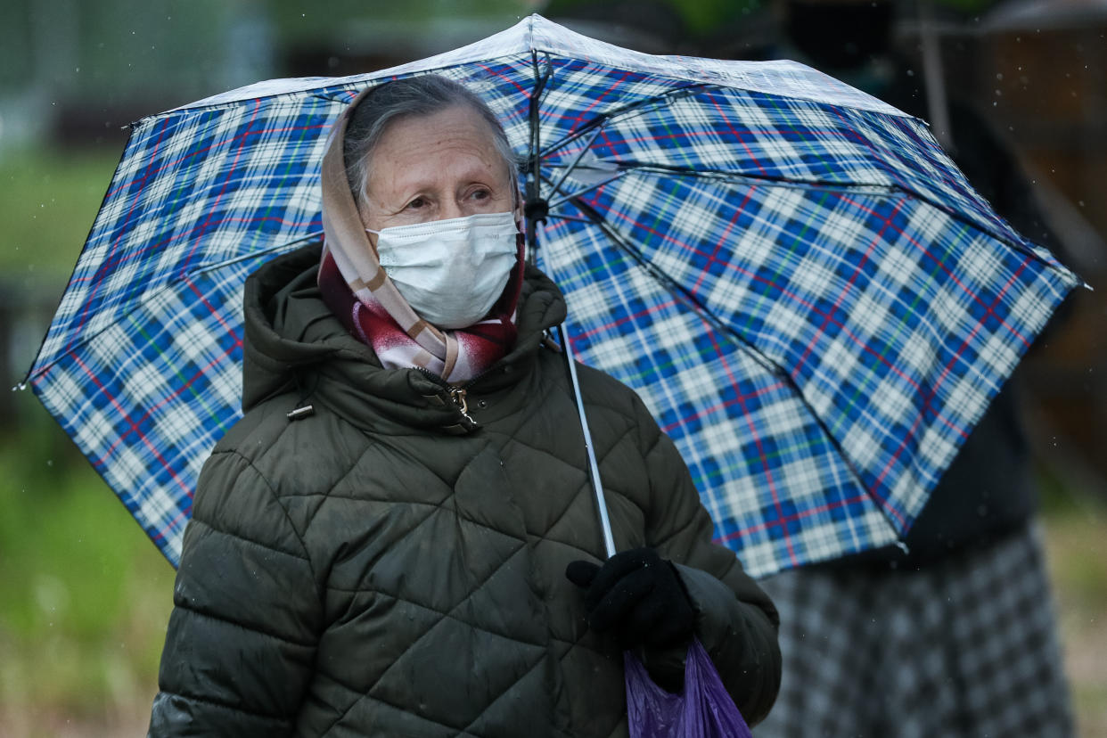 MOSCOW REGION, RUSSIA - JUNE 3, 2020: A believer is seen outside St George Cathedral in the village of Nakhabino, Krasnogorsk District, during a liturgy. Religious institutions open for public in Moscow Region from June 3 as COVID-19 restrictions ease. Mikhail Tereshchenko/TASS (Photo by Mikhail Tereshchenko\TASS via Getty Images)