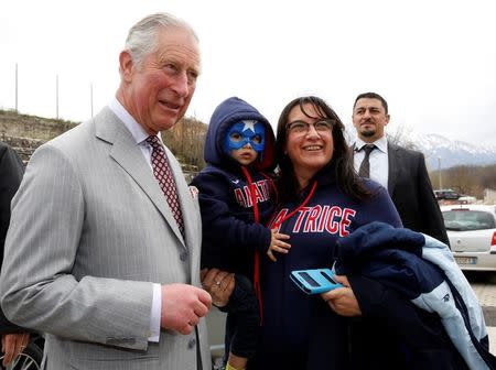 Britain's Prince Charles meet residents as he visit to the town of Amatrice, which was levelled after an earthquake last year, in central Italy April 2, 2017. REUTERS/Alessandro Bianchi