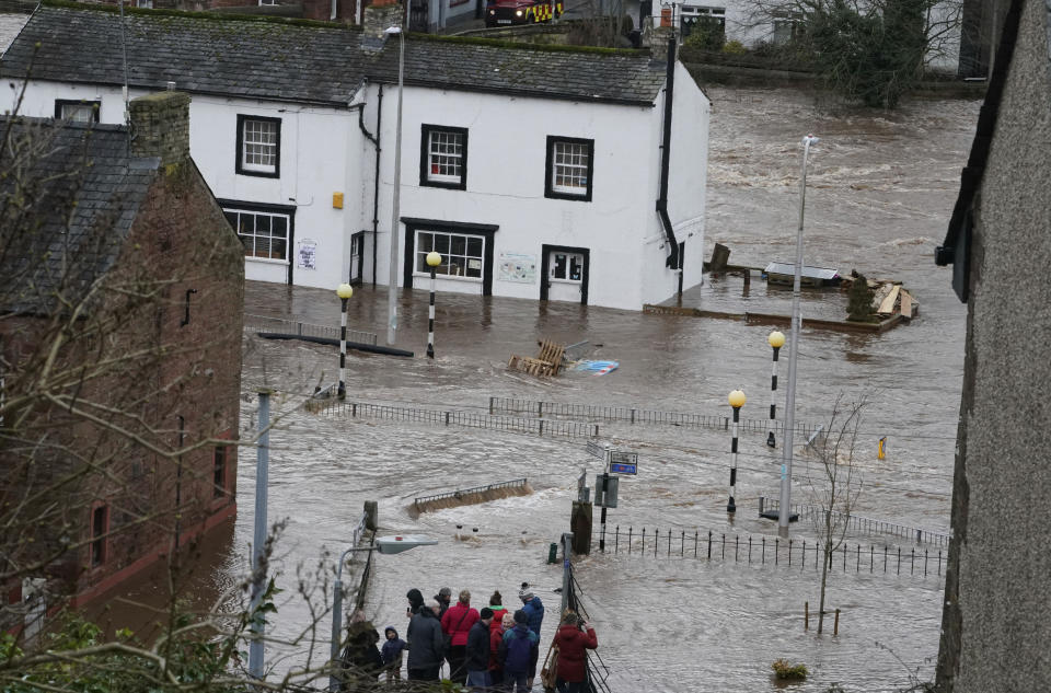 A view of a flooded street in Appleby-in-Westmorland, as Storm Ciara hits the UK, in Cumbria, England, Sunday Feb. 9, 2020. Trains, flights and ferries have been cancelled and weather warnings issued across the United Kingdom as a storm with hurricane-force winds up to 80 mph (129 kph) batters the region. (Owen Humphreys/PA via AP)