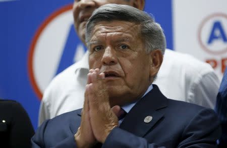 Peru's presidential candidate Cesar Acuna talks to the media after the electoral board rejected the wealthy former governor and center-left populist's appeal to stay in the presidential elections, in Lima March 9, 2016. REUTERS/Mariana Bazo