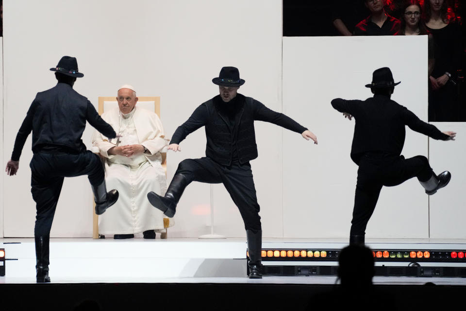 Pope Francis looks at dancers during a meeting with young people at the Laszlo Papp Budapest Sports Arena, in Budapest, Hungary, Saturday, April 29, 2023. (AP Photo/Andrew Medichini)