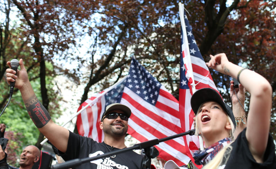FILE - In this June 30, 2018, file photo, Joey Gibson, left, leader of Patriot Prayer, participates in the group's rally in Portland, Ore. The man who was fatally shot in Portland on Saturday, Aug. 29, 2020, as supporters of President Donald Trump skirmished with Black Lives Matter protesters was a supporter of a right-wing group called Patriot Prayer and a good friend of its founder, Gibson. (Mark Graves/The Oregonian via AP, File)