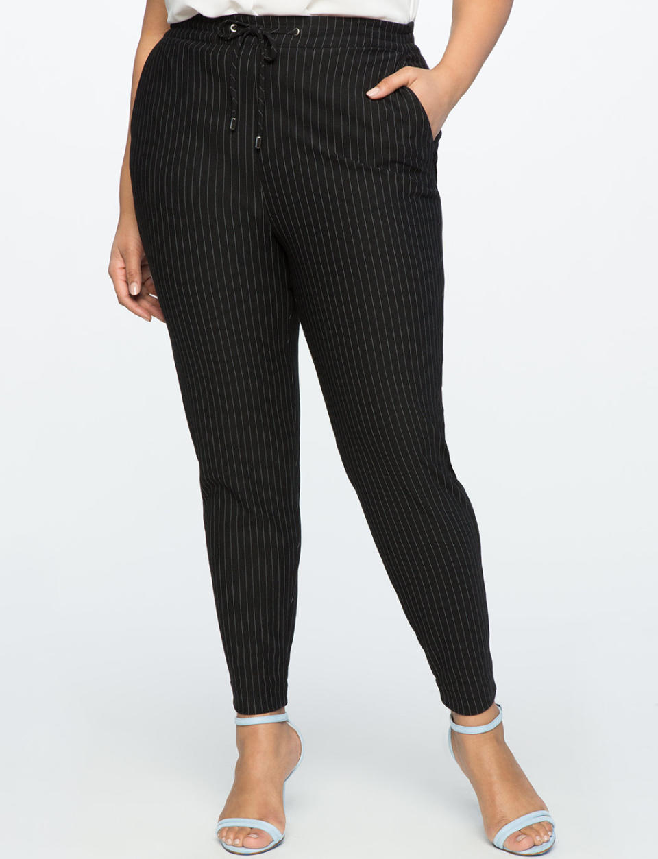 Get it at <a href="http://www.eloquii.com/pull-on-pinstripe-trouser/1184410.html?cgid=pants&amp;dwvar_1184410_colorCode=150&amp;start=55" target="_blank">Eloquii</a>, $80.