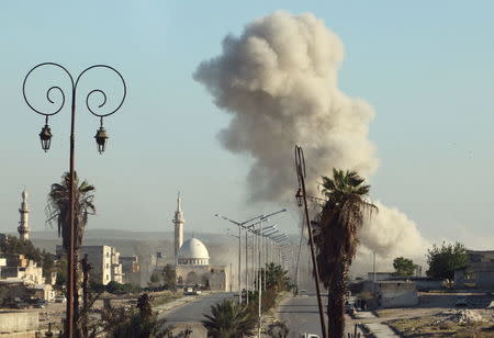 Smoke rises after an airstrike in the rebel held area of old Aleppo, Syria April 18, 2016. REUTERS/Abdalrhman Ismail