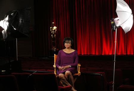 Academy President Cheryl Boone Isaacs poses for a portrait inside the The Samuel Goldwyn theatre at the Academy of Motion Picture Arts and Sciences in Beverly Hills, California February 19, 2014. REUTERS/Mario Anzuoni