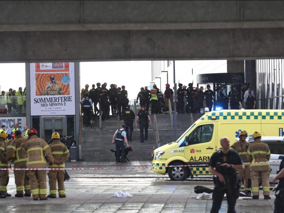 Police officers and rescuers are seen in front of the mall (Olafur Steinar Gestsson/Ritzau Scanpix/AFP via Getty Images)