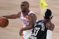 Oklahoma City Thunder's Chris Paul (3) works to get past Houston Rockets' Robert Covington (33) during the first half of an NBA first-round playoff basketball game in Lake Buena Vista, Fla., Wednesday, Sept. 2, 2020. (AP Photo/Mark J. Terrill)