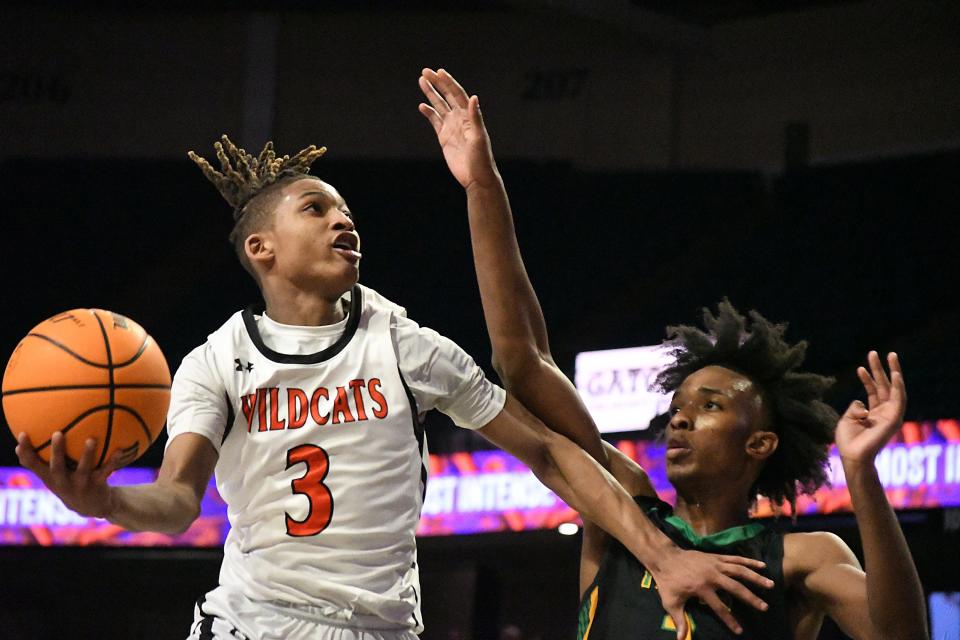 New Hanover's #3 Rodmik Allen drives to the basket for a shot as New Hanover took on Richmond in the 2024 NCHSSAA Men’s Basketball Championship playoff game Thursday March 14, 2024 at the LJVM Coliseum in Winston-Salem, N.C. New Hanover won 55-53 and will move on to the State Championship game Saturday. KEN BLEVINS/STARNEWS