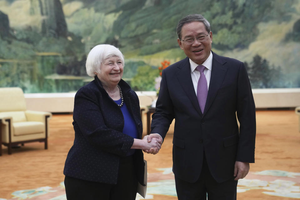 U.S. Treasury Secretary Janet Yellen, left, meets Chinese Premier Li Qiang at the Great Hall of the People in Beijing, China, Sunday, April 7, 2024. Yellen, who arrived later in Beijing after starting her five-day visit in one of China's major industrial and export hubs, said the talks would create a structure to hear each other's views and try to address American concerns about manufacturing overcapacity in China. (AP Photo/Tatan Syuflana, Pool)