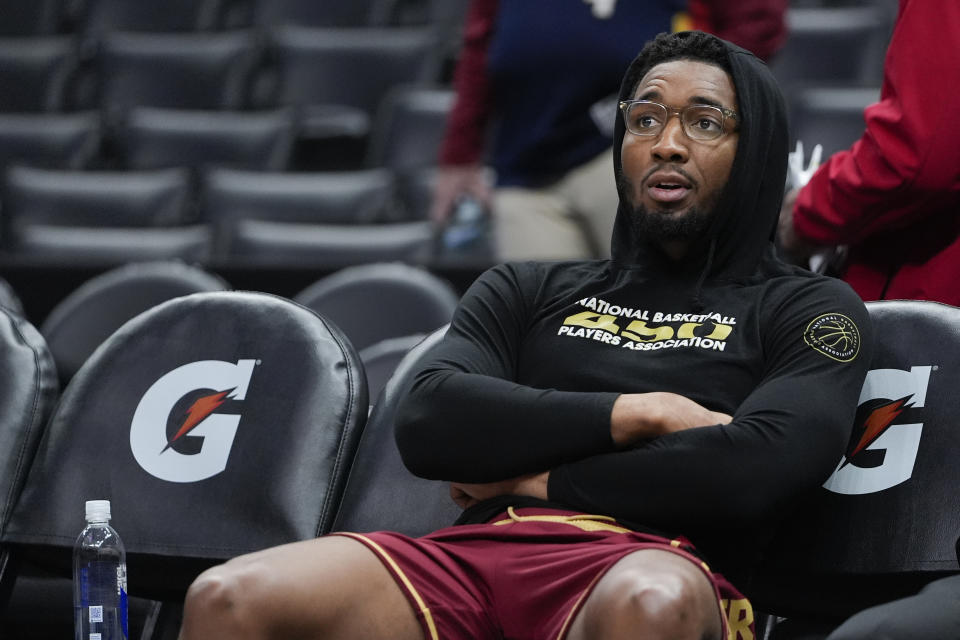 Cleveland Cavaliers guard Donovan Mitchell looks on before an NBA basketball game against the Los Angeles Clippers, Sunday, April 7, 2024, in Los Angeles. (AP Photo/Ryan Sun)