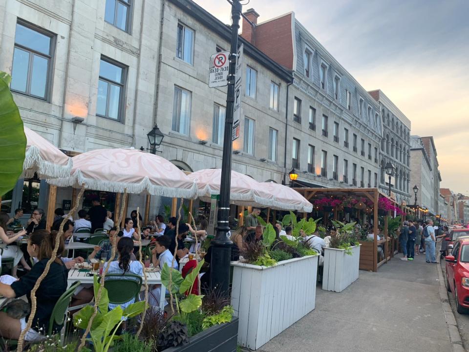 row of restaurants with outdoor seating in montreal