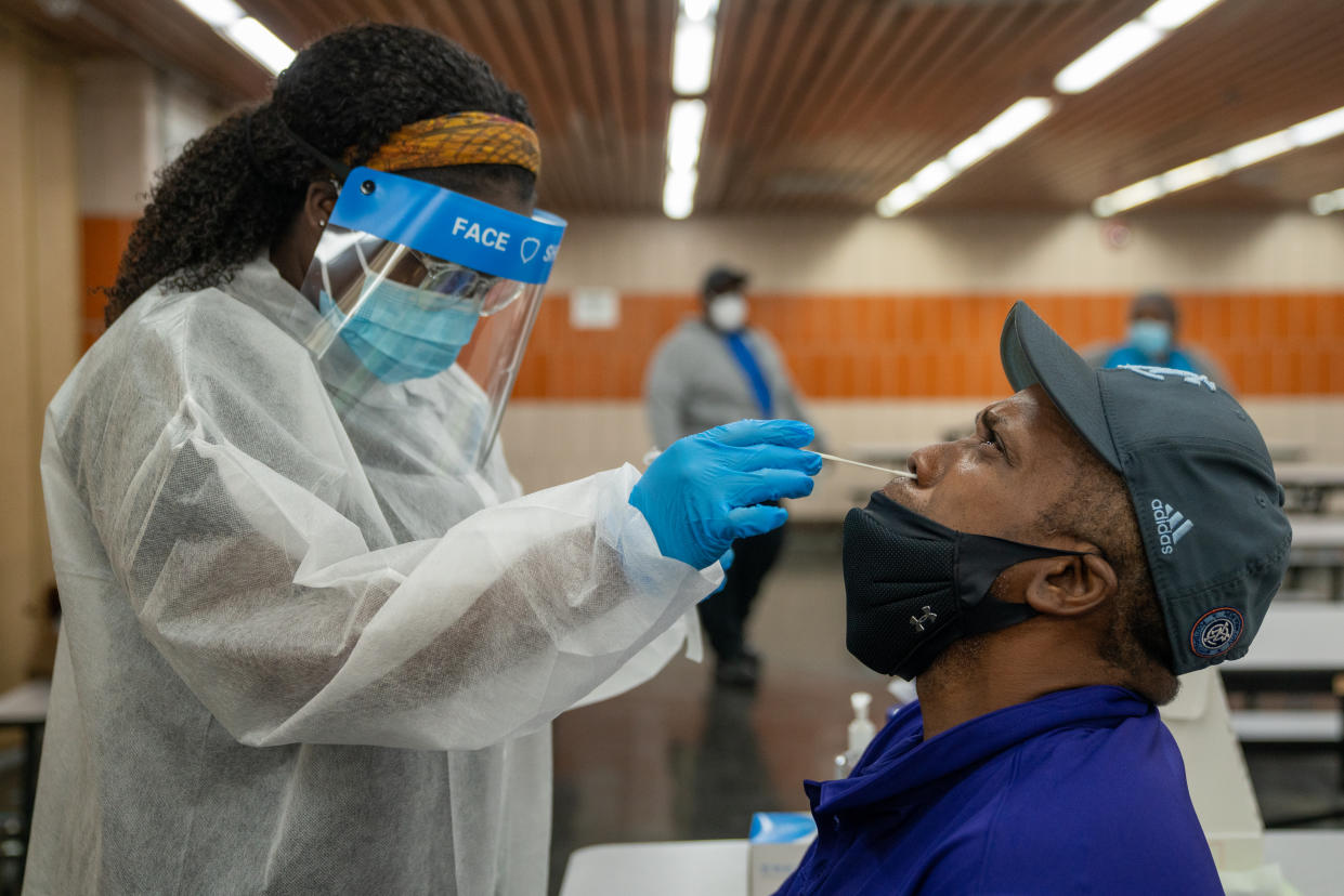 NEW YORK, NY - OCTOBER 30: Jeffery Pettyjohn, a signal light maintainer for the MTA, is administered a COVID-19 test on October 30, 2020 in New York City. The MTA has deployed COVID-19 screening sites for its employees at their bus depots and train yards, as coronavirus infections have eclipsed the 9 million threshold since the first confirmed case in the U.S. two hundred and eighty three days ago.(Photo by David Dee Delgado/Getty Images)