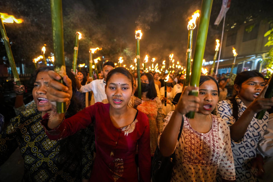 All Assam Students Union (AASU) members take out a torch procession to protest against the Citizenship Amendment Act (CAA) in Guwahati, India, Tuesday, March 12, 2024. India has implemented a controversial citizenship law that has been widely criticized for excluding Muslims, a minority community whose concerns have heightened under Prime Minister Narendra Modi's Hindu nationalist government. The act provides a fast track to naturalization for Hindus, Parsis, Sikhs, Buddhists, Jains and Christians who fled to Hindu-majority India from Afghanistan, Bangladesh and Pakistan before Dec. 31, 2014. (AP Photo/Anupam Nath)