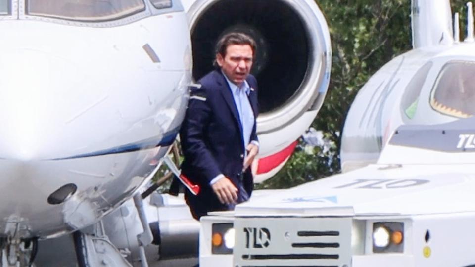 Florida Gov. and GOP presidential hopeful Ron DeSantis arrives by jet at Cape Cod Gateway Airport In Hyannis on Saturday enroute to a private fundraiser in Cotuit. About 100 protesters were outside the home on Putnam Avenue where the fundraiser was being held. DeSantis drew much criticism last September when he chartered a flight containing 50 mostly Venezuelan migrants from Texas to Martha’s Vineyard, a political move to "own the liberals" that local politicians denounced.