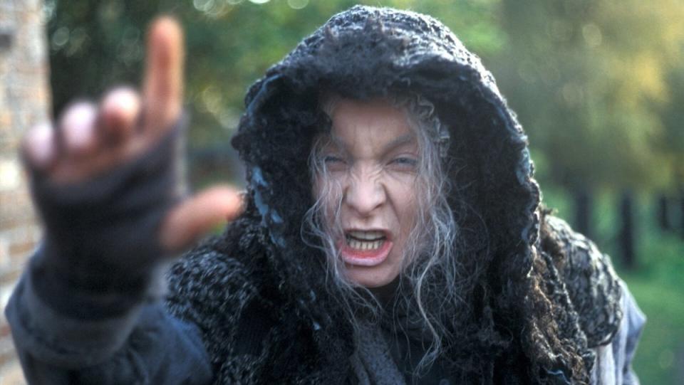 The Rani dresses as a haggard witch who shouts into the camera in the historical Doctor Who story, "The Mark of the Rani."
