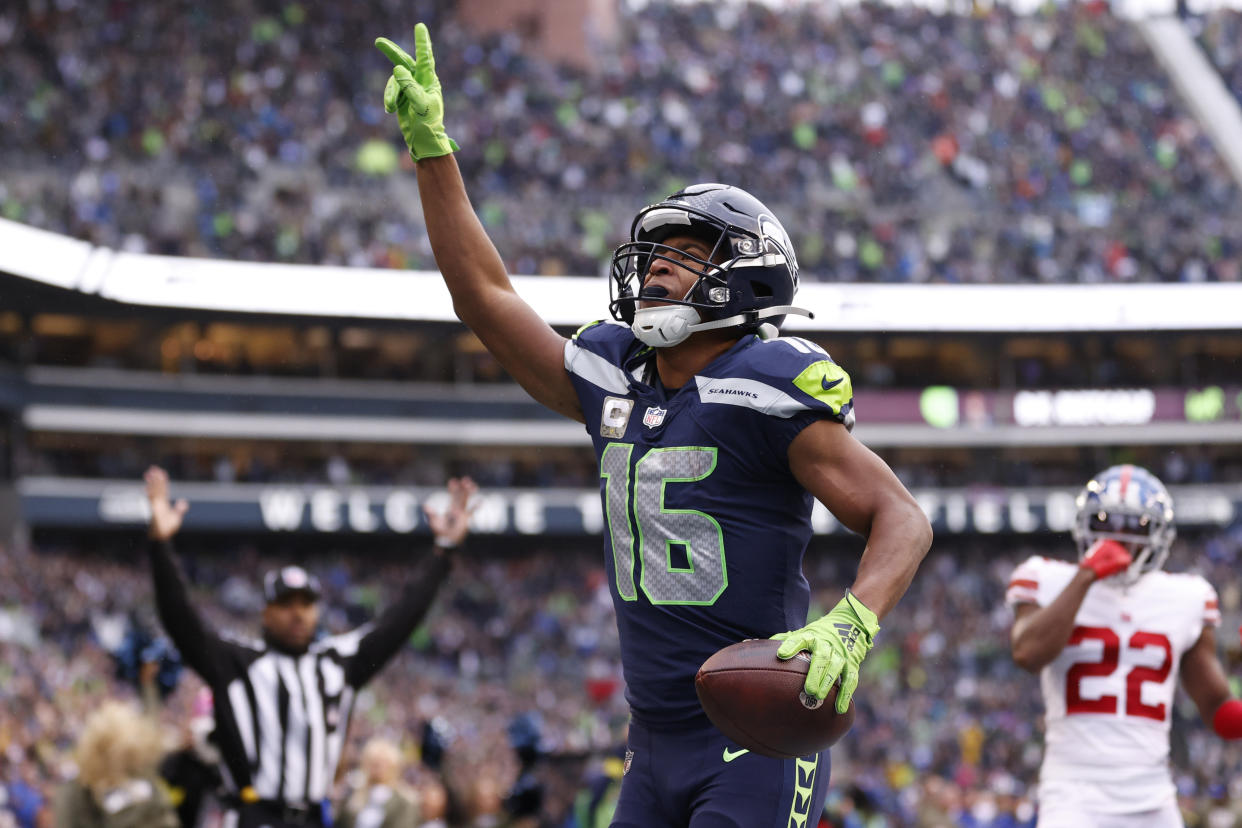 SEATTLE, WASHINGTON - OCTOBER 30: Tyler Lockett #16 of the Seattle Seahawks celebrates a touchdown against the New York Giants during the fourth quarter at Lumen Field on October 30, 2022 in Seattle, Washington. (Photo by Steph Chambers/Getty Images)