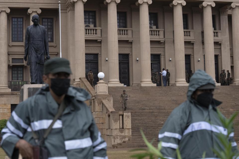 Army soldiers stand guard after removing the protesters and their tents from the site of a protest camp outside the Presidential Secretariat in Colombo, Sri Lanka, Friday, July 22, 2022. (AP Photo/Rafiq Maqbool)