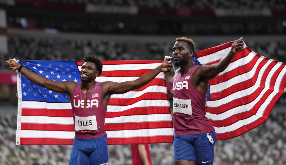 <p>Kenneth Bednarek, of United States, silver, and Noah Lyles, of United States, bronze, react after the final of the men's 200-meters at the 2020 Summer Olympics, Wednesday, Aug. 4, 2021, in Tokyo, Japan. (AP Photo/Francisco Seco)</p> 