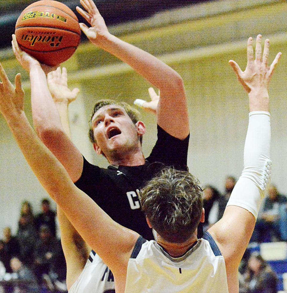 Waverly-South Shore's Carter Comes shoots over Great Plains Lutheran's Sam Hansen during their Eastern Coteau Conference boys basketball game Tuesday night in Watertown. Great Plains Lutheran won 58-51.