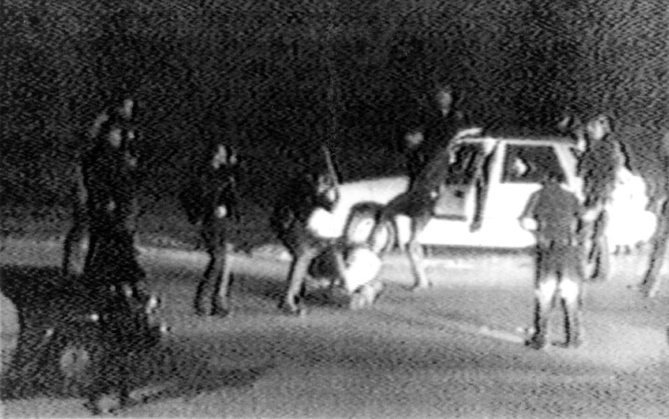FILE - This March 31, 1991 image made from video shot by George Holliday shows police officers beating a man, later identified as Rodney King. King, the Black motorist whose 1991 videotaped beating by Los Angeles police officers was the touchstone for one of the most destructive periods of racial unrest in the nation's history. (AP Photo/Courtesy of KTLA Los Angeles, George Holliday)