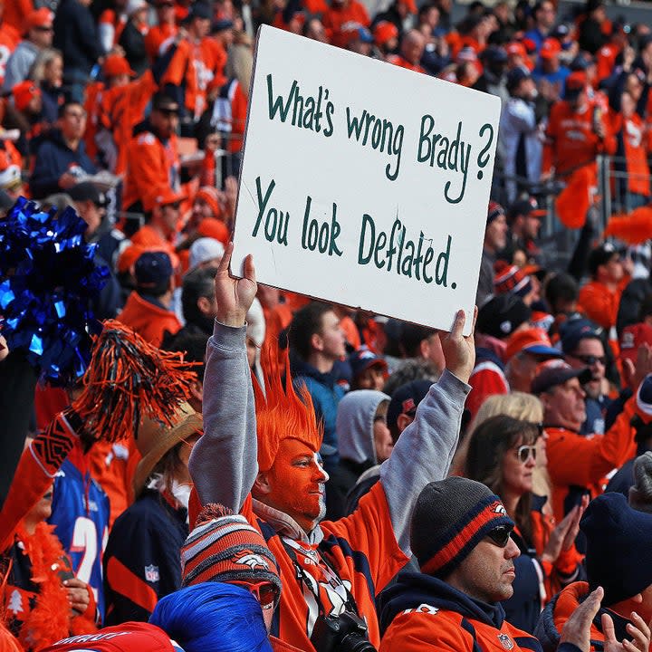 fan with a sign reading, what's wrong, brady you look deflated