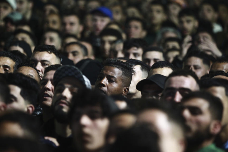 Algerian soccer supporters watch on a giant screen the African Cup of Nations Group D soccer match between Algeria and Burkina Faso at the Peace of Bouake stadium in Bouake, Ivory Coast, Tuesday, Jan.23, 2024 in Algiers. (AP Photo/Fateh Guidoum)